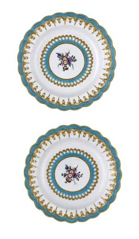 Appraisal: A PAIR OF WORCESTER FLUTED PLATES enamelled with a central