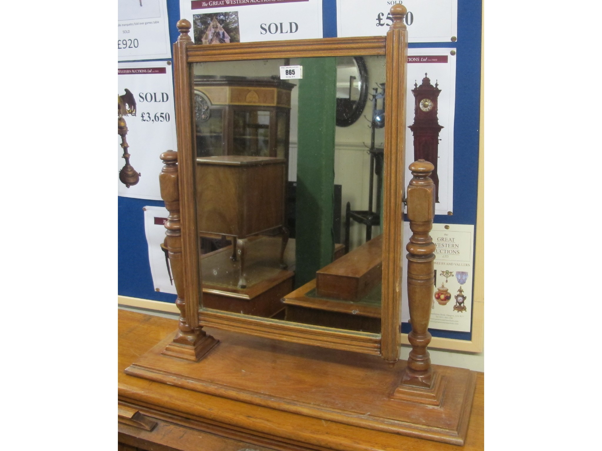 Appraisal: An oak mirror on stand