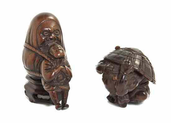 Appraisal: Two Carved Wood Netsuke one of an oni with a