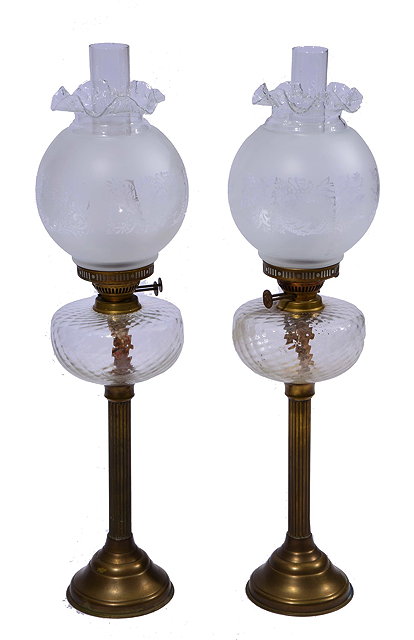 Appraisal: A PAIR OF PARAFFIN LAMPS each with foliate acid etched