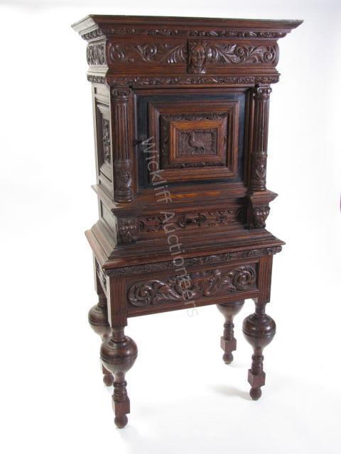 Appraisal: A fine quality antique English carved oak -piece cabinet with