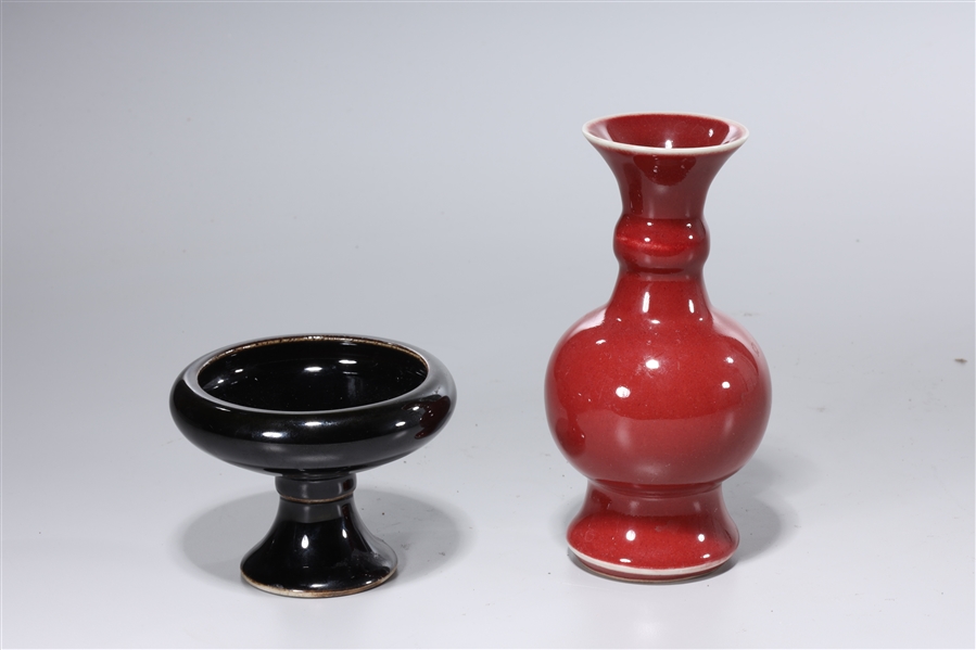 Appraisal: Two Chinese monochrome porcelains including a red vase and black