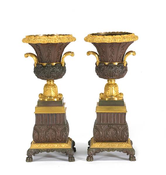 Appraisal: A pair of Charles X patinated and gilt bronze urns