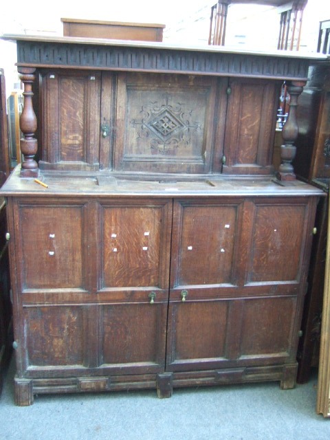 Appraisal: A th century and later 'made-up' court cupboard with single