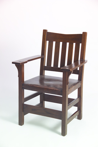 Appraisal: GUSTAV STICKLEY V-back armchair with five vertical back slats and