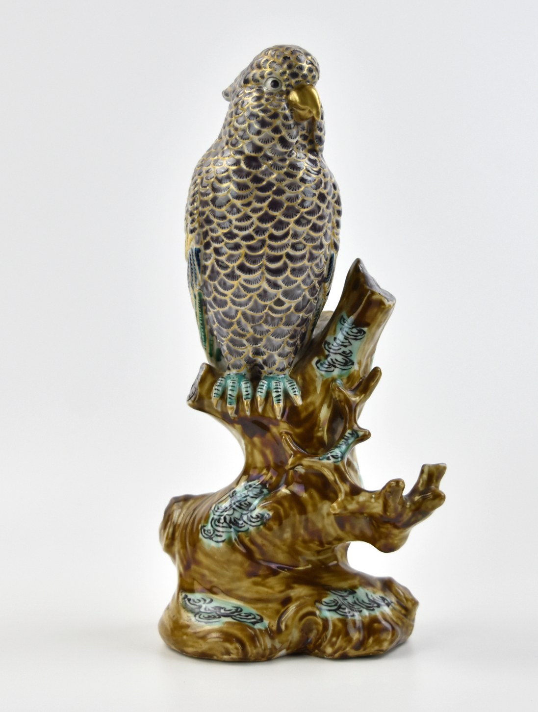 Appraisal: a finely painted Japanese parrot statue with a parrot perching