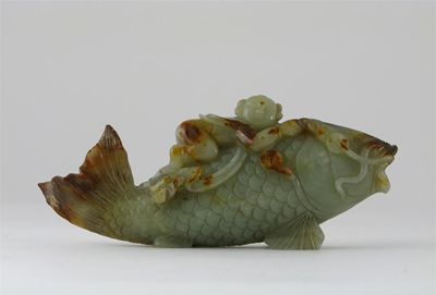 Appraisal: A Chinese jade carving of a carp with a boy