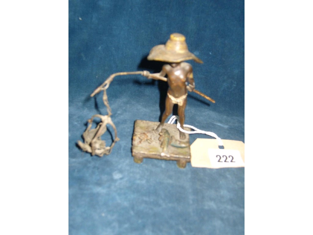 Appraisal: A cold painted bronze figure of a fishing boy wearing