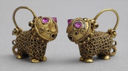 Appraisal: ISLAMIC GOLD EARRINGS Pair of stylized animals with circular spots