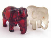 Appraisal: Two small elephants one frosted glass with inset eyes the