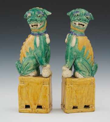 Appraisal: A Pair of Glazed Ceramic Foo Dogs Ceramic glazed in