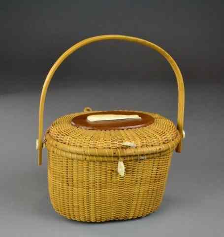 Appraisal: NANTUCKET BASKET PURSE W OXBONE WHALENice woven purse with wooden