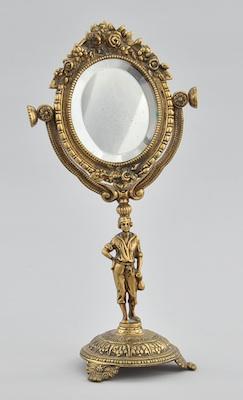 Appraisal: A Decorative Cast Brass Figurative Dresser Top Mirror The mirror