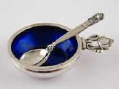 Appraisal: Georg Jensen A siver salt with integral blue glass liner