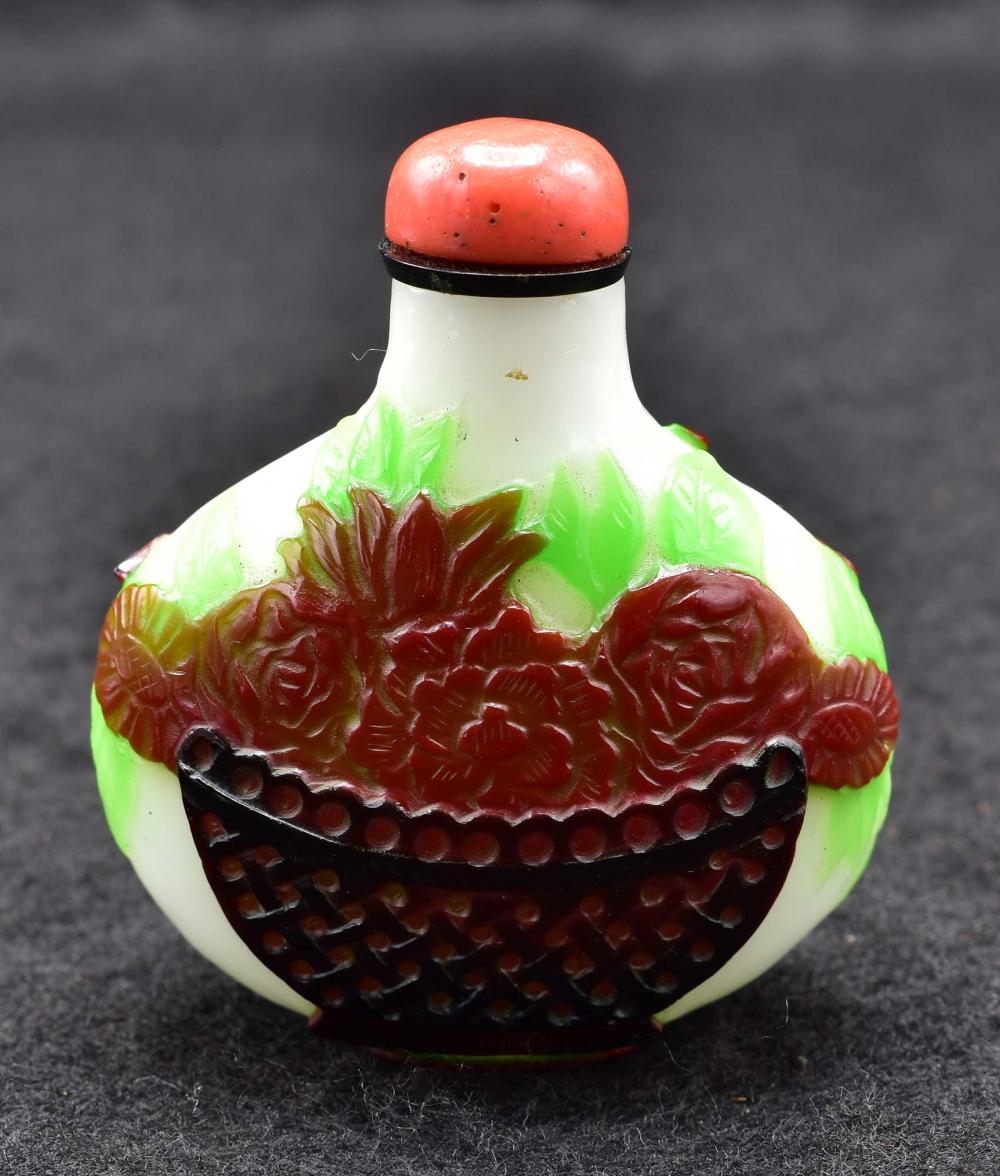 Appraisal: CHINESE THREE-COLOR PEKING GLASS SNUFF BOTTLEThe circular vessel decorated with