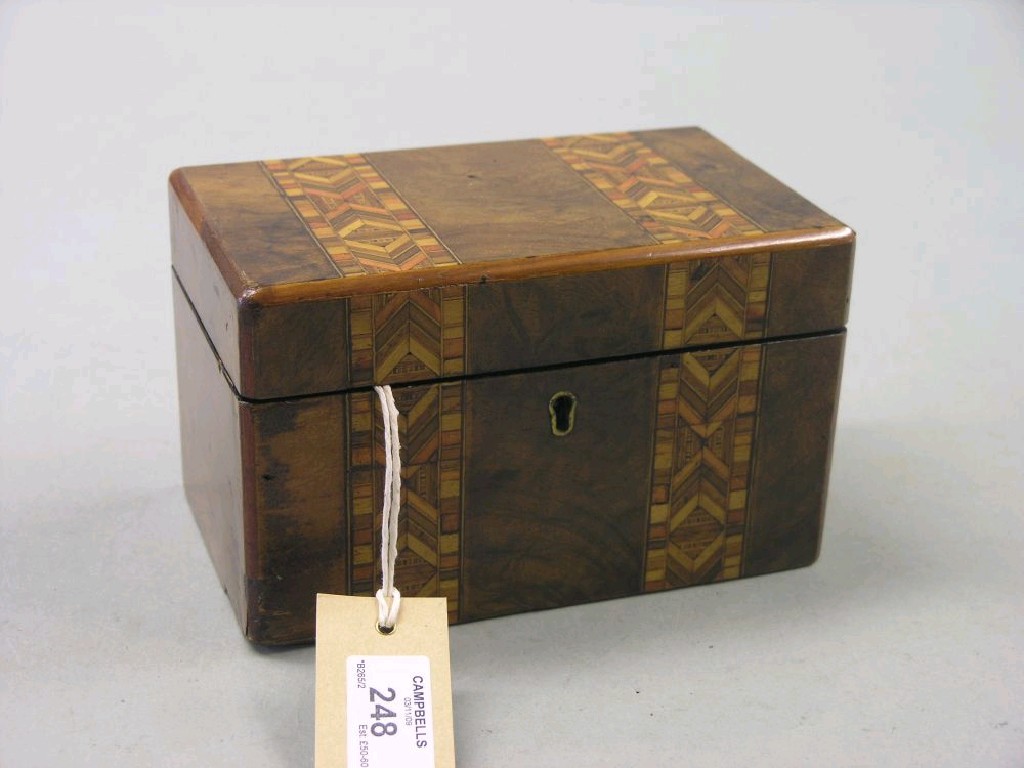 Appraisal: A Victorian walnut and parquetry tea caddy inlaid with two