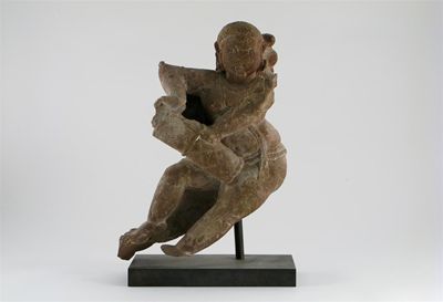 Appraisal: A sandstone carving of a female figure dancing playing a