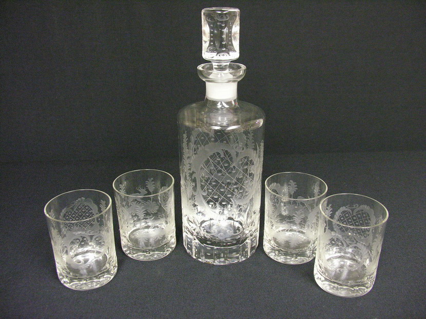 Appraisal: ETCHED CRYSTAL DECANTER SET Stag and doe motif are on