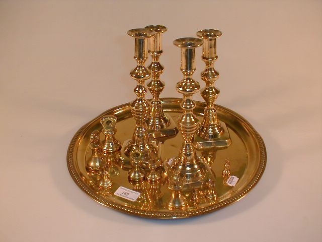 Appraisal: Brass ware including small brass weights four candlesticks and a