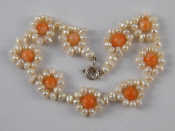 Appraisal: A cultured pearl and coral bracelet Length approx cm width