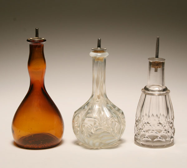 Appraisal: Three Victorian barber hair tonic bottles amber bottle from T