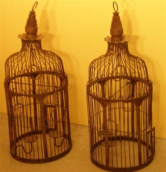 Appraisal: Pair of wrought metal domed hanging birdcages with bar three