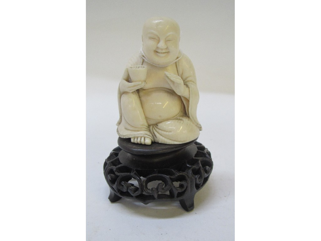 Appraisal: Carved ivory figure of a Hotei