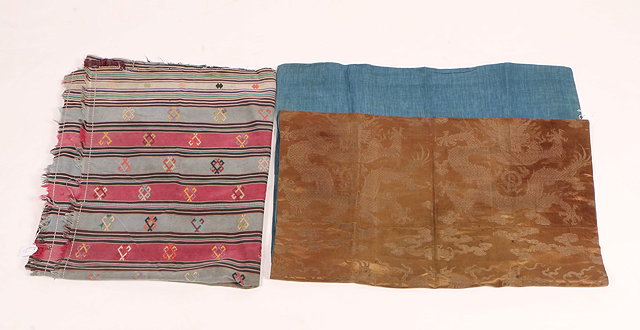 Appraisal: A BHUTANESE STRIP WOVEN SILK AND EMBROIDERED TEXTILE together with