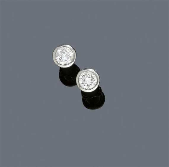 Appraisal: DIAMOND EAR STUD White gold Classic solitaire ear stud collet-set