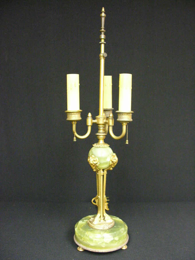 Appraisal: JADE COLOR ONYX AND BRASS LAMP Cast Rams Heads and