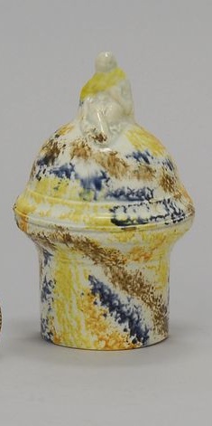 Appraisal: PEARLWARE PRATTWARE BIRD FEEDER Early th CenturyWith orange blue yellow