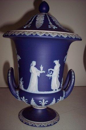 Appraisal: A Wedgwood campana shaped vase and cover decorated Classical figures