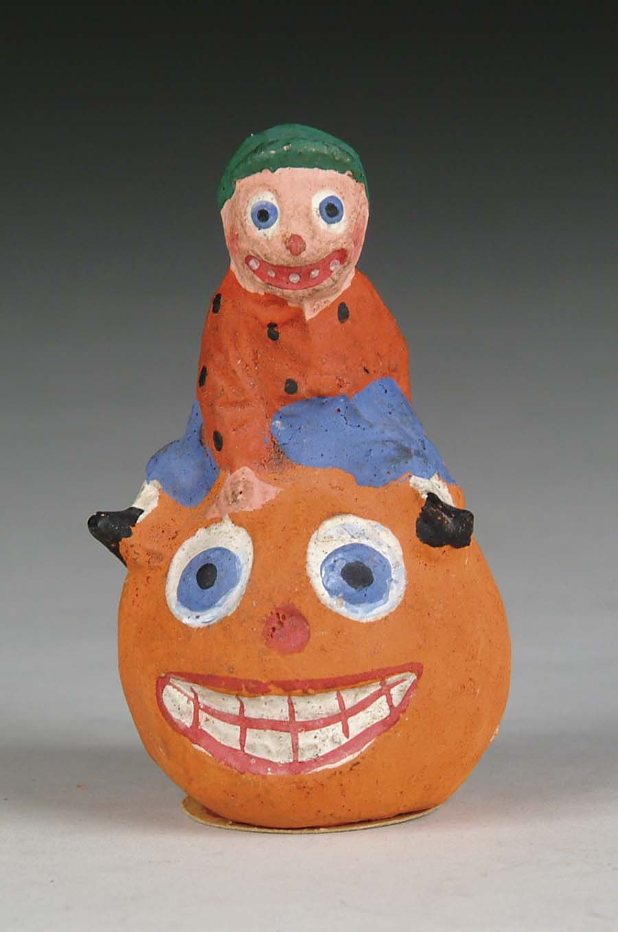 Appraisal: BOY ON PUMPKIN CONTAINER All composition depiction of wide-eyed boy