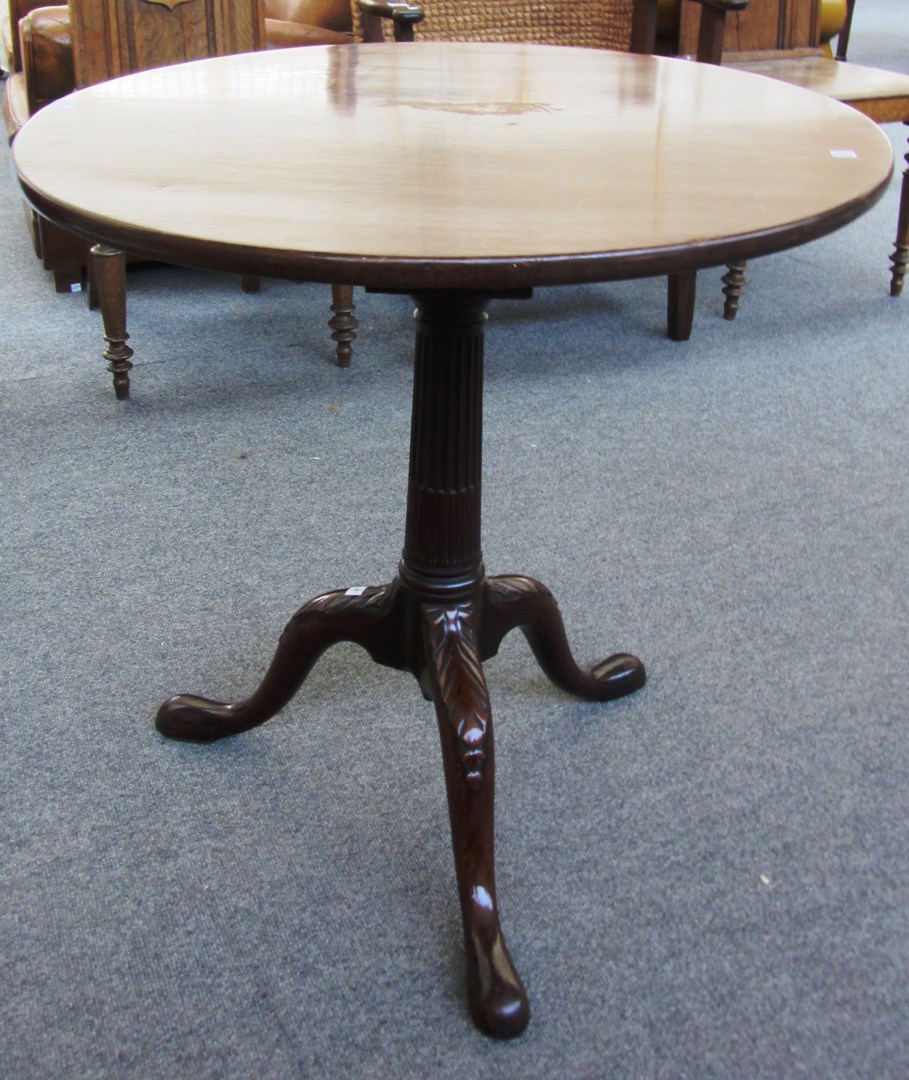 Appraisal: A George III mahogany circular snap top occasional table on