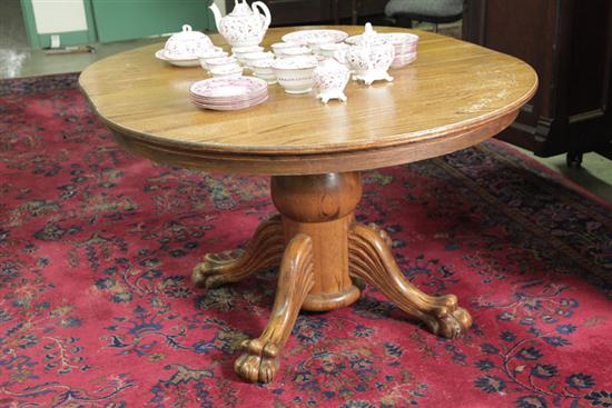 Appraisal: PEDESTAL TABLE Oak having a circular top and column on