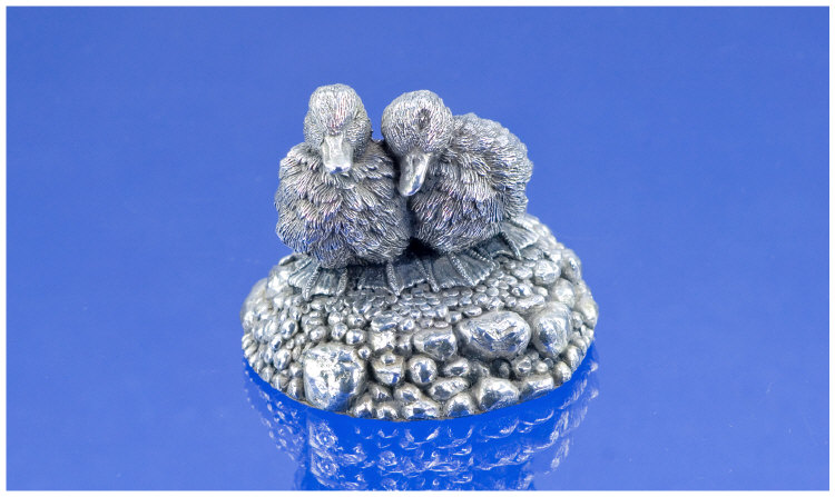 Appraisal: A Well Modelled Pair of Silver Ducks Huddled on a