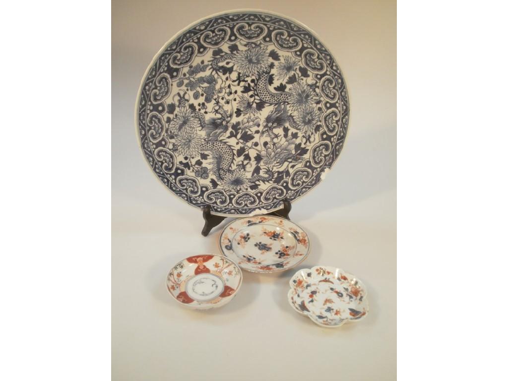 Appraisal: A large Chinese blue and white charger AF three smaller