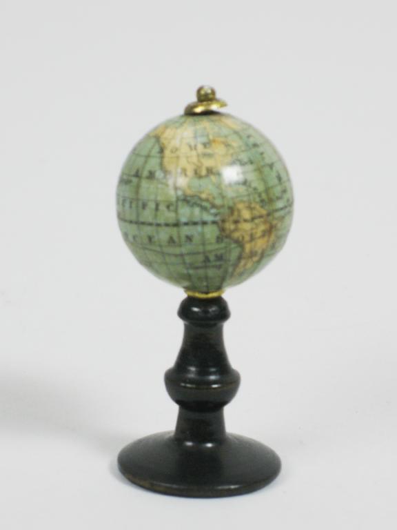 Appraisal: A miniature Revolving Globe on ebonised column in