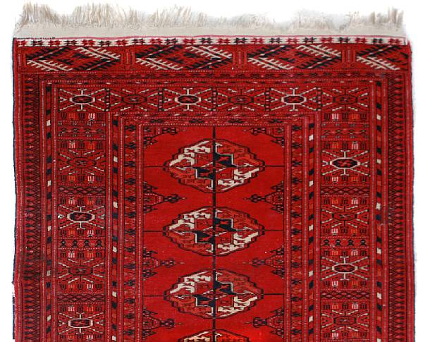 Appraisal: A Turkish mat together with a Turkaman rug size of