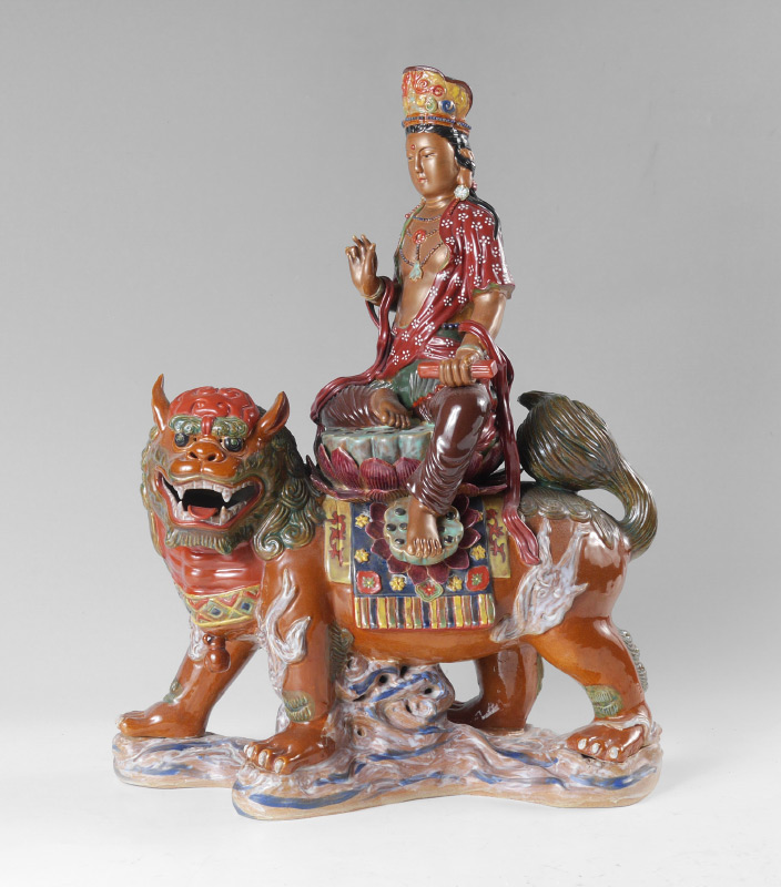 Appraisal: CHINESE POLYCHROME CERAMIC FIGURE OF BUDDHA Figure of Buddha riding