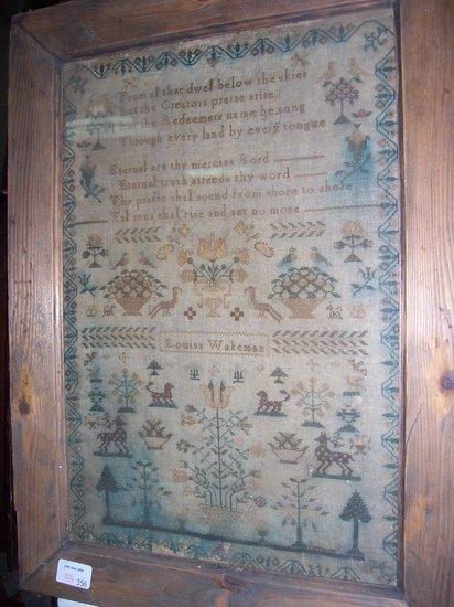 Appraisal: A needlework sampler by Louisa Wakeman embroidered flowers foliage animals