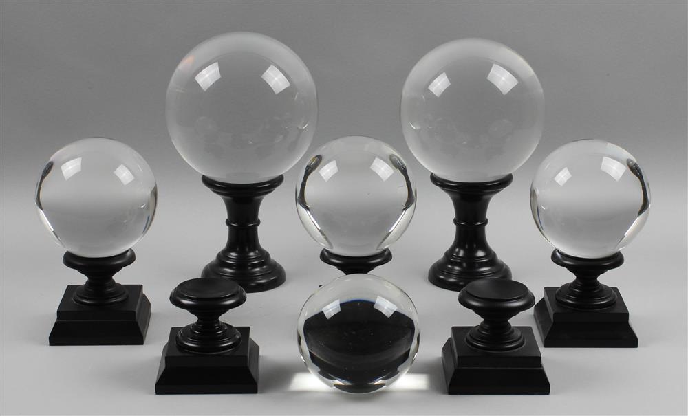 Appraisal: GROUP OF SIX CRYSTAL BALLS ON EBONIZED WOOD STANDS five