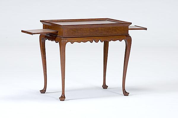 Appraisal: QUEEN ANNE-STYLE TEA TABLE A th century mahogany Queen Anne-style