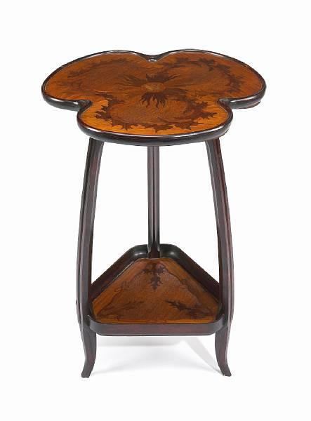 Appraisal: A Majorelle mahogany and fruitwood two-tier table circa underside stenciled