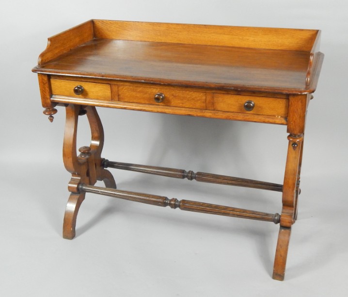 Appraisal: A Victorian oak wash stand with a galleried back and