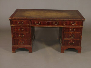 Appraisal: A mahogany twin pedestal writing desk early th century the