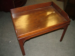 Appraisal: A mahogany butlers tray on stand th century the raised