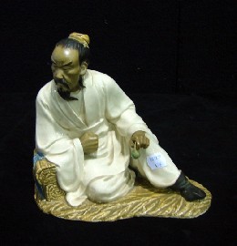 Appraisal: A Japanese glazed ceramic figure of a seated scholar cm