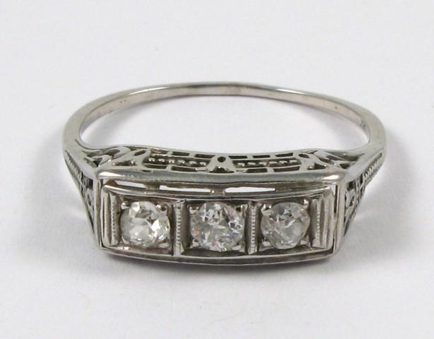 Appraisal: DIAMOND AND EIGHTEEN KARAT GOLD RING The pierced white gold