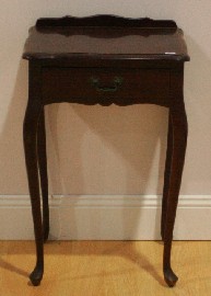 Appraisal: A reproduction single drawer side table cm wide cm deep